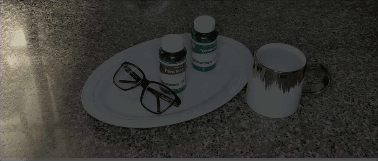 Lexi-Bell supplements arranged beside a cup and glasses